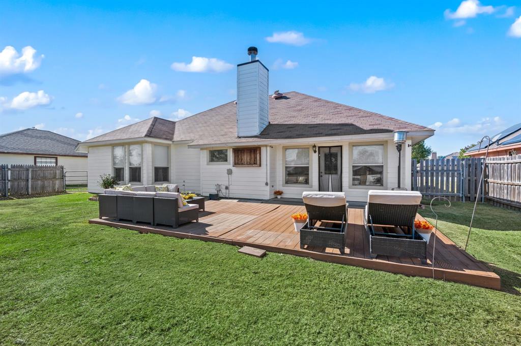 305 Maverick Trail Oak Point, TX 75068 - Photo 34 of 40 a house view with a sitting space and garden