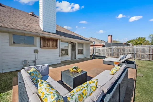 a view of an outdoor sitting area with furniture