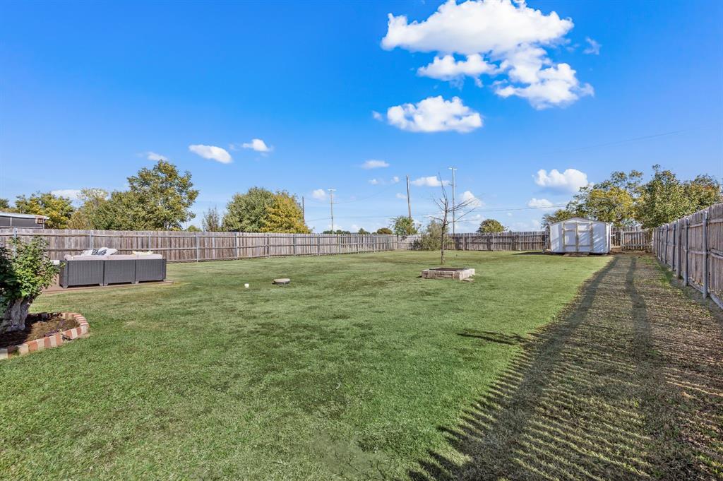 305 Maverick Trail Oak Point, TX 75068 - Photo 36 of 40 a view of a golf course with a big yard