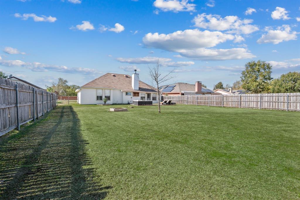 305 Maverick Trail Oak Point, TX 75068 - Photo 37 of 40 a view of a house with a yard and sitting area