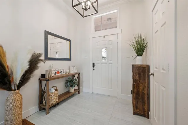 a view of livingroom with furniture and a potted plant