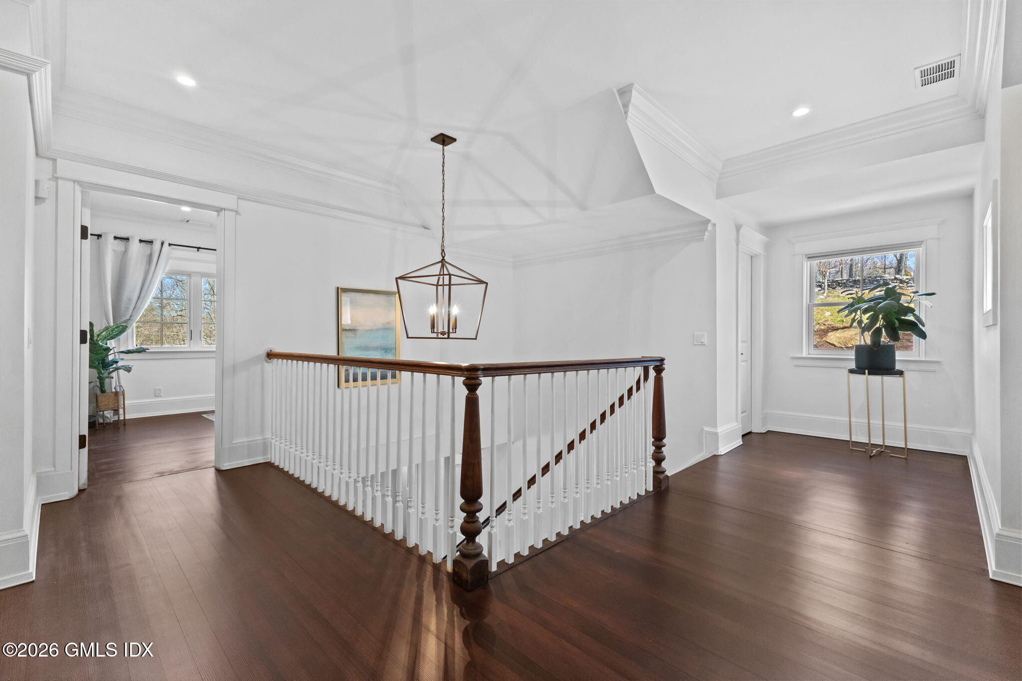 311 Riversville Road Greenwich, CT 06831 - Photo 14 of 32 a view of a hallway with wooden floor and stairs