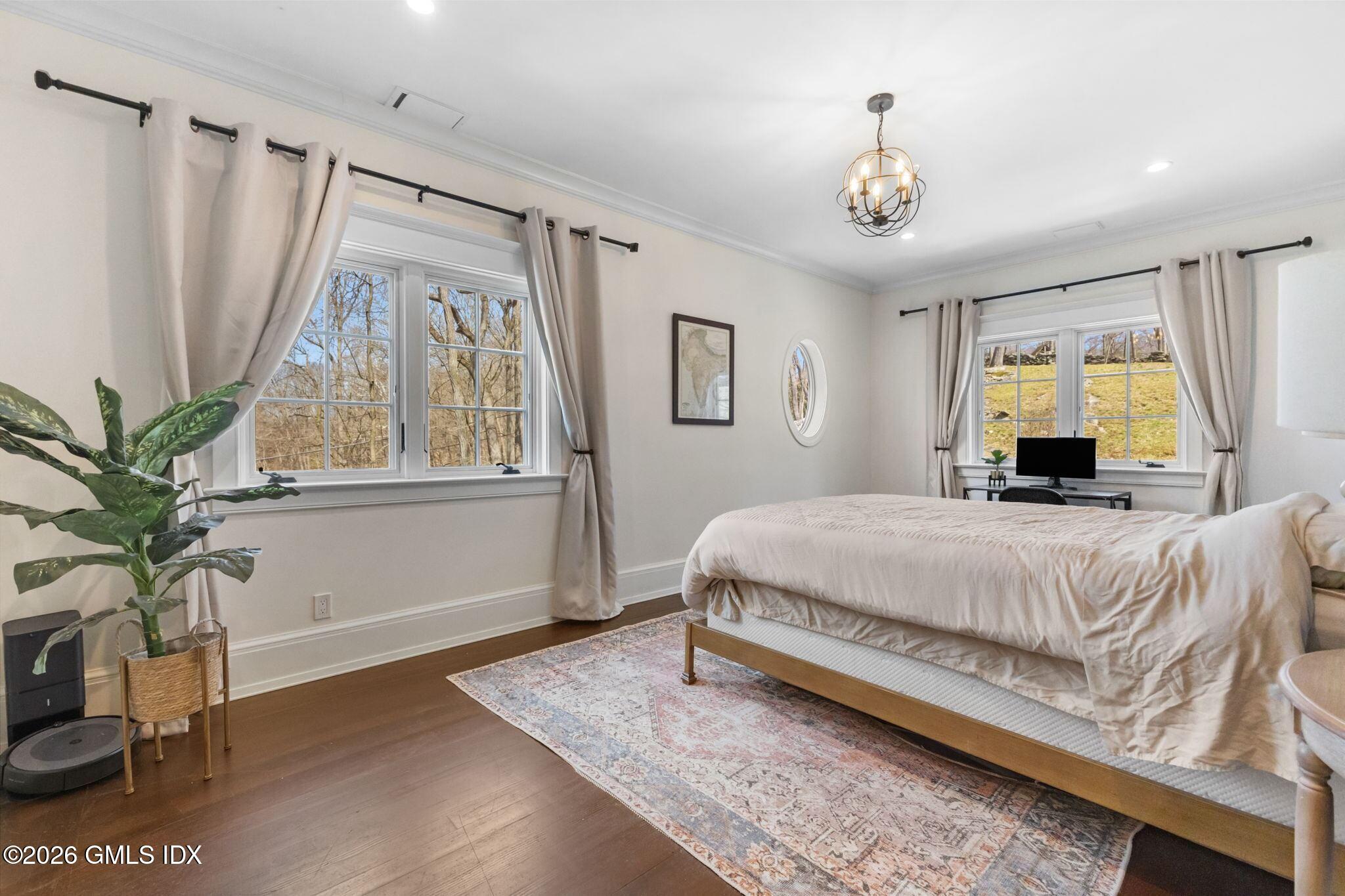 311 Riversville Road Greenwich, CT 06831 - Photo 16 of 32 a spacious bedroom with a bed and a window