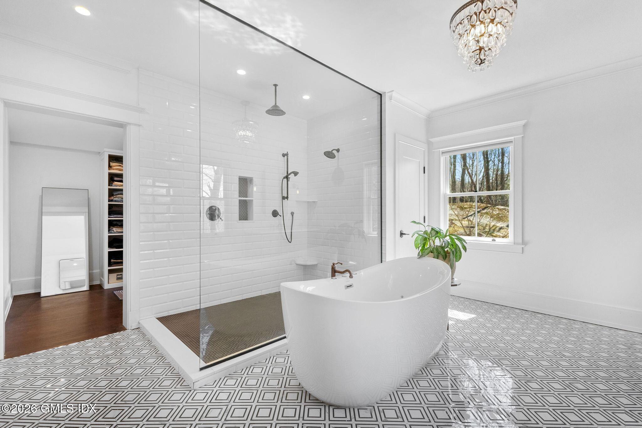 311 Riversville Road Greenwich, CT 06831 - Photo 22 of 32 a bathroom with a bathtub and shower