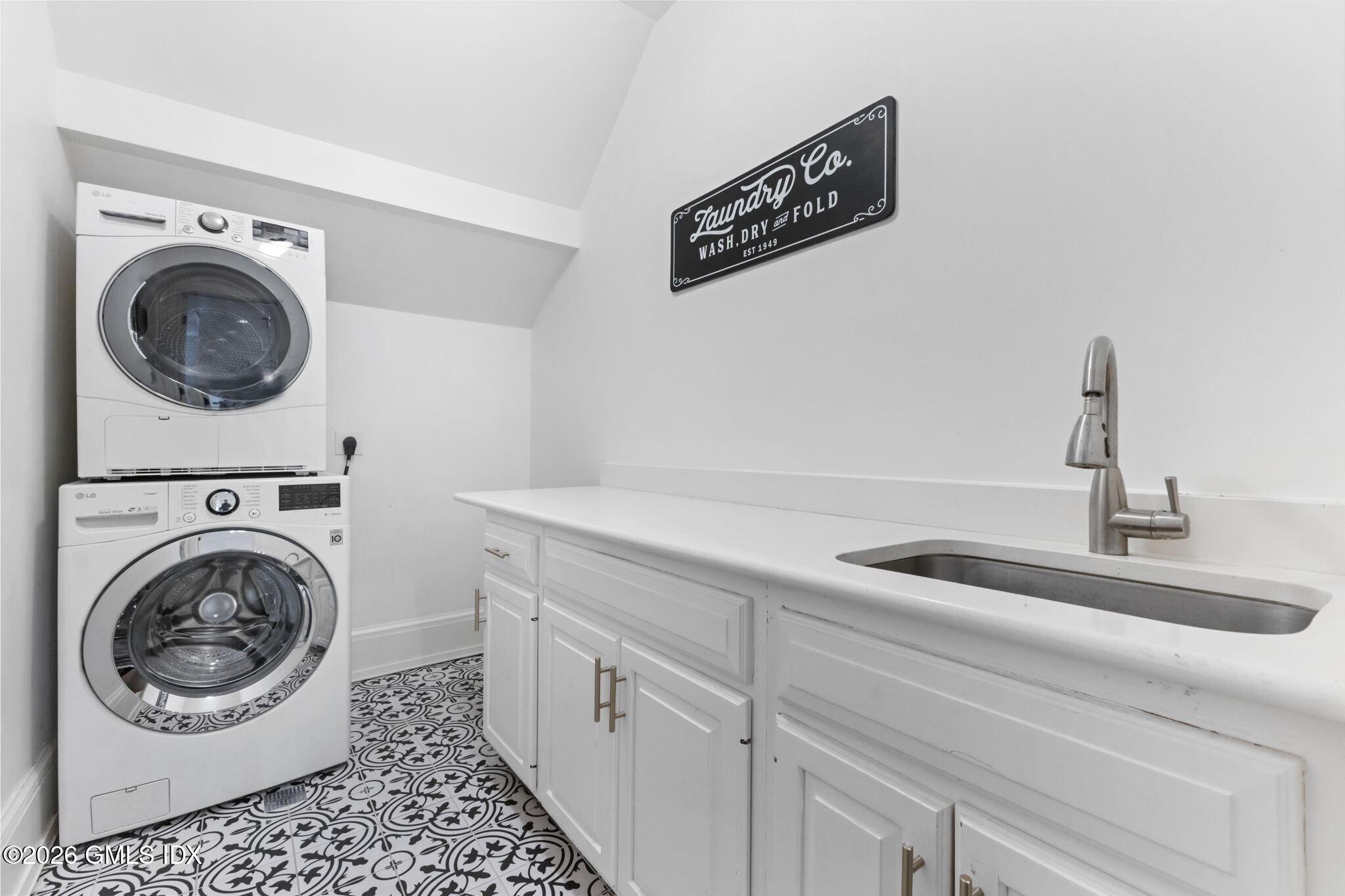 311 Riversville Road Greenwich, CT 06831 - Photo 25 of 32 a utility room with sink dryer and washer