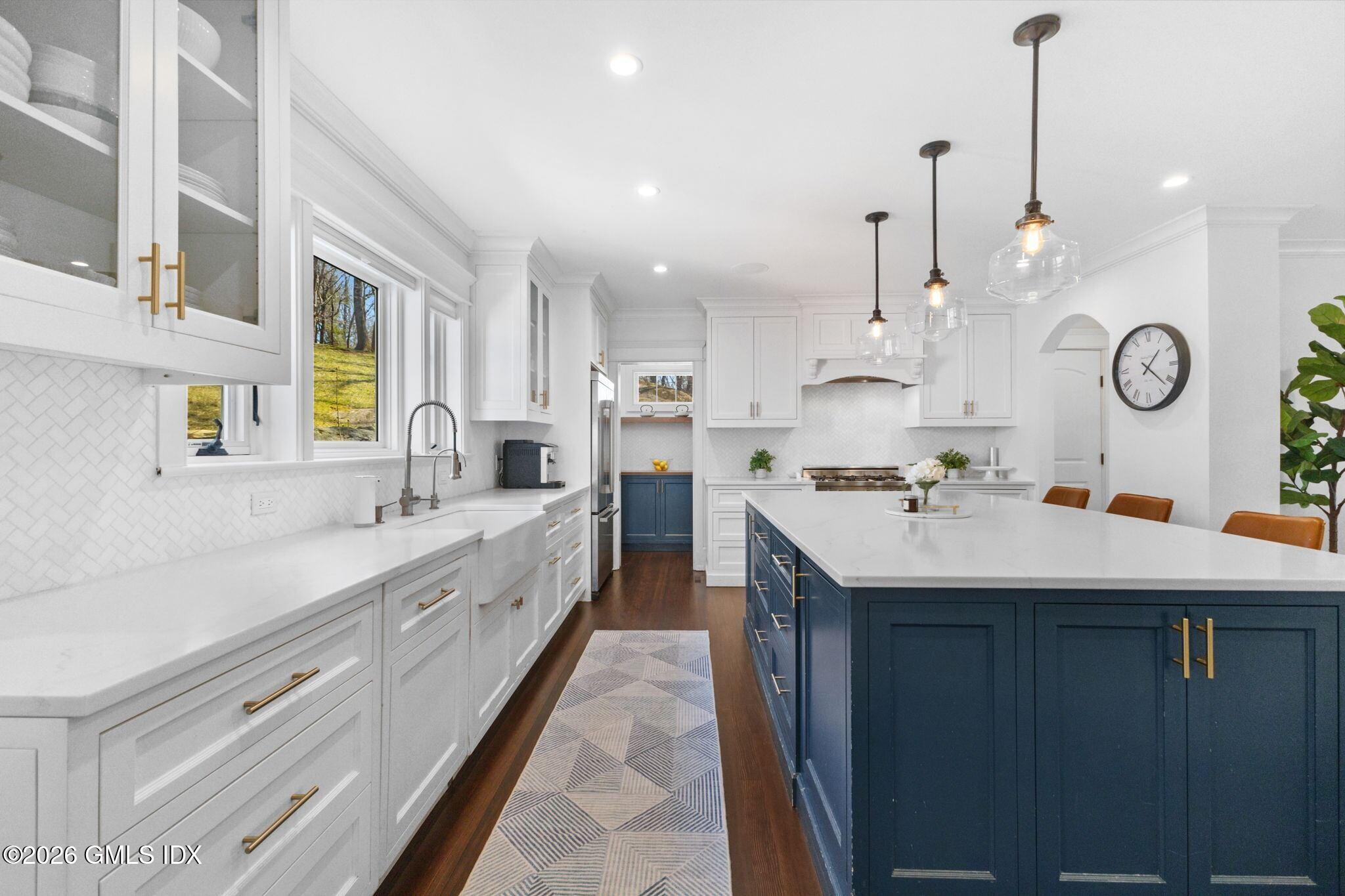 311 Riversville Road Greenwich, CT 06831 - Photo 4 of 32 a large white kitchen with a large window