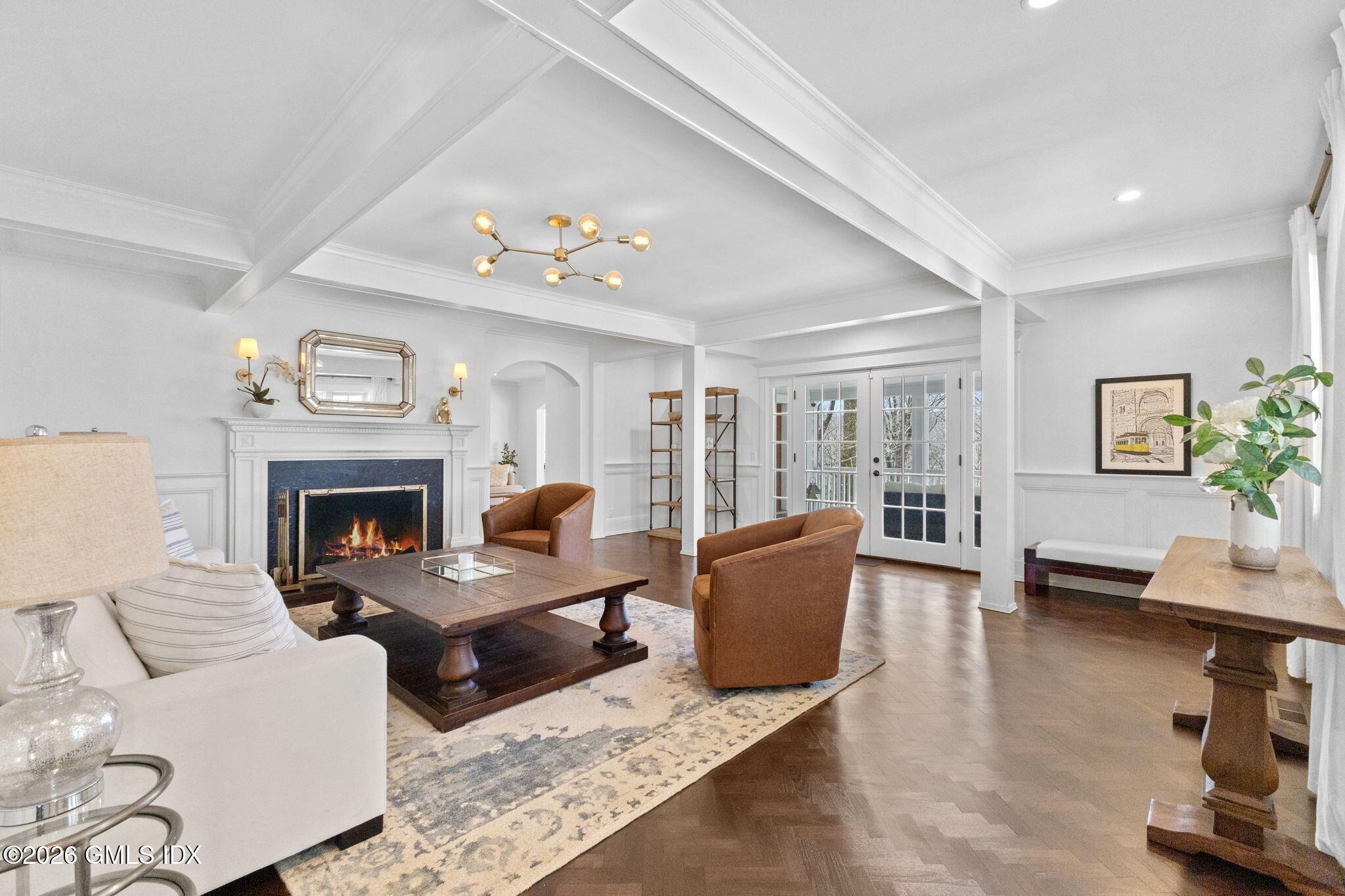 311 Riversville Road Greenwich, CT 06831 - Photo 10 of 32 a living room with furniture large window and a fireplace