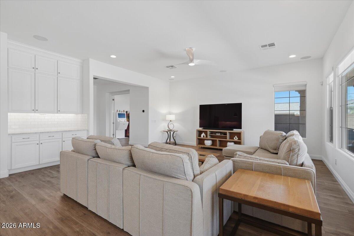 22608 East Stacey Road Queen Creek, AZ 85142 - Photo 21 of 83 a living room with furniture and a flat screen tv