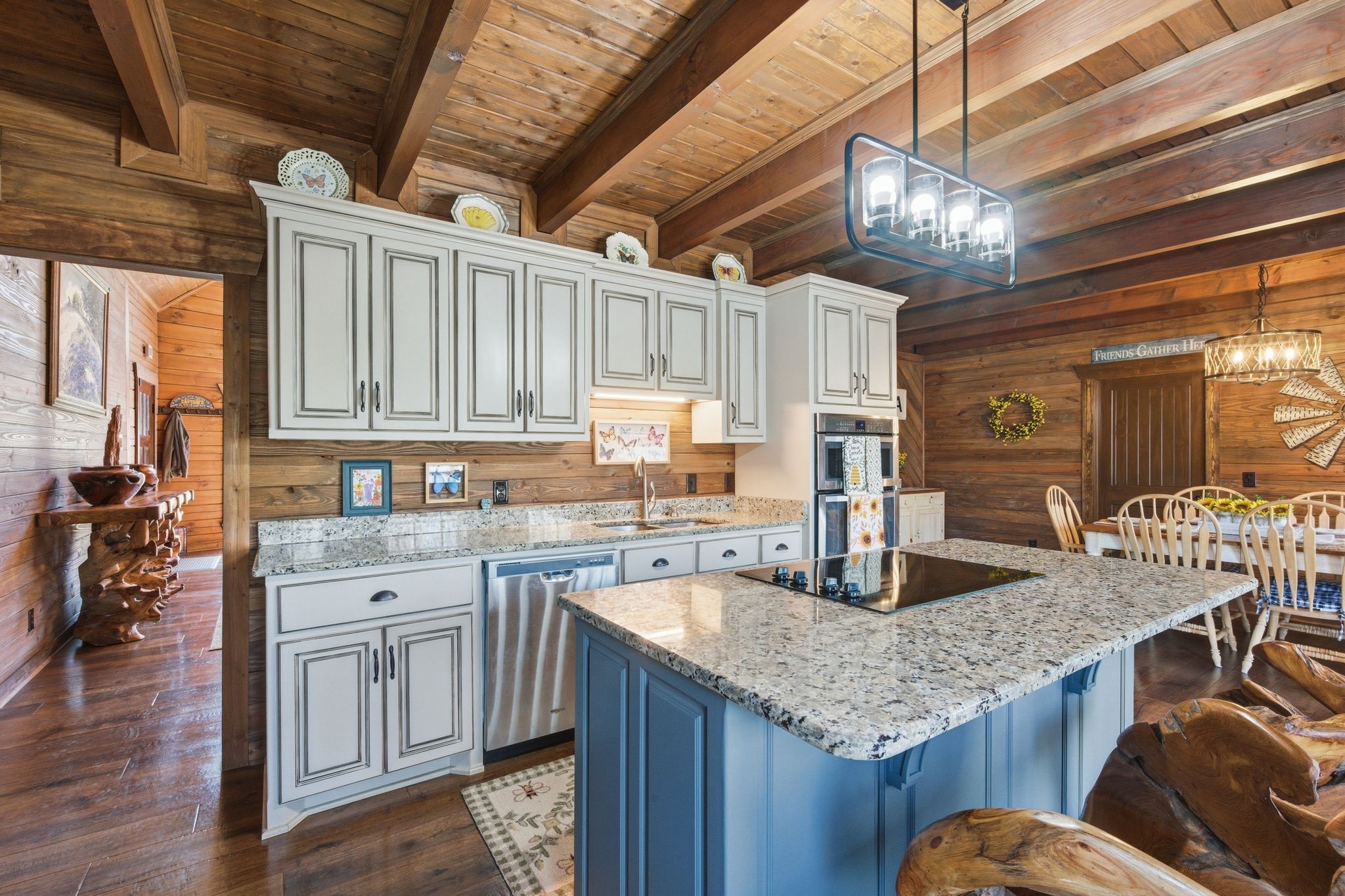 1118 Carrollville Landing Road Clifton, TN 38425 - Photo 23 of 92 a kitchen with stainless steel appliances granite countertop a table chairs and wooden cabinets