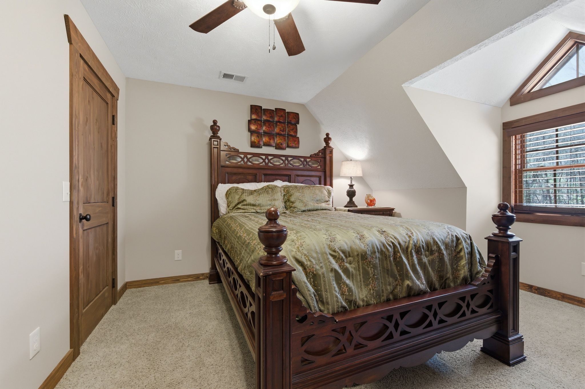 1118 Carrollville Landing Road Clifton, TN 38425 - Photo 42 of 92 a bed sitting in a bedroom next to a window