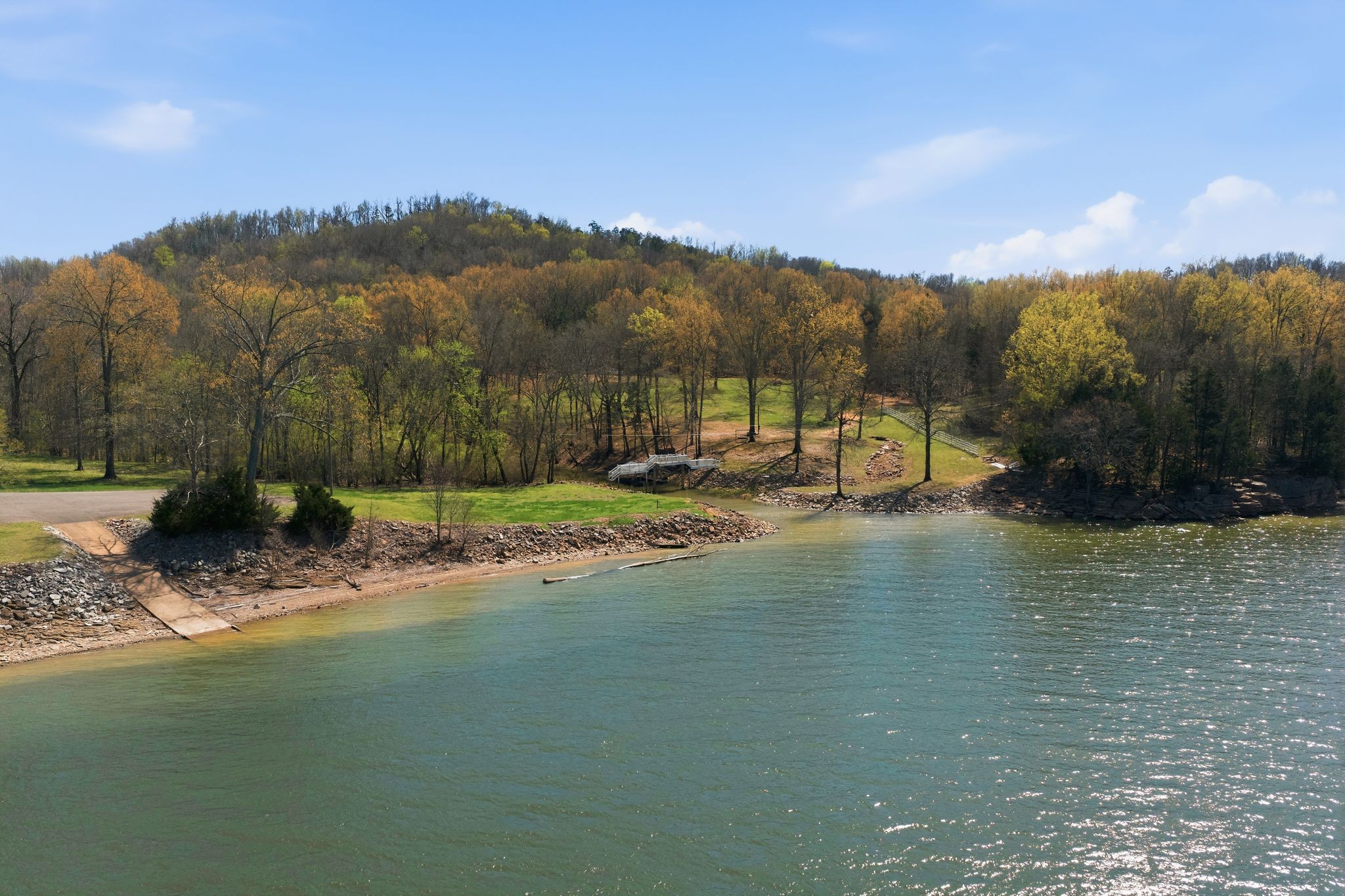1118 Carrollville Landing Road Clifton, TN 38425 - Photo 68 of 92 a view of a lake with a mountain in the background