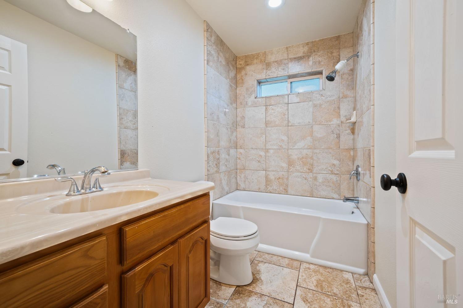 84 Front Street Camp Meeker, CA 95419 - Photo 11 of 24 a bathroom with a sink a toilet and a bathtub