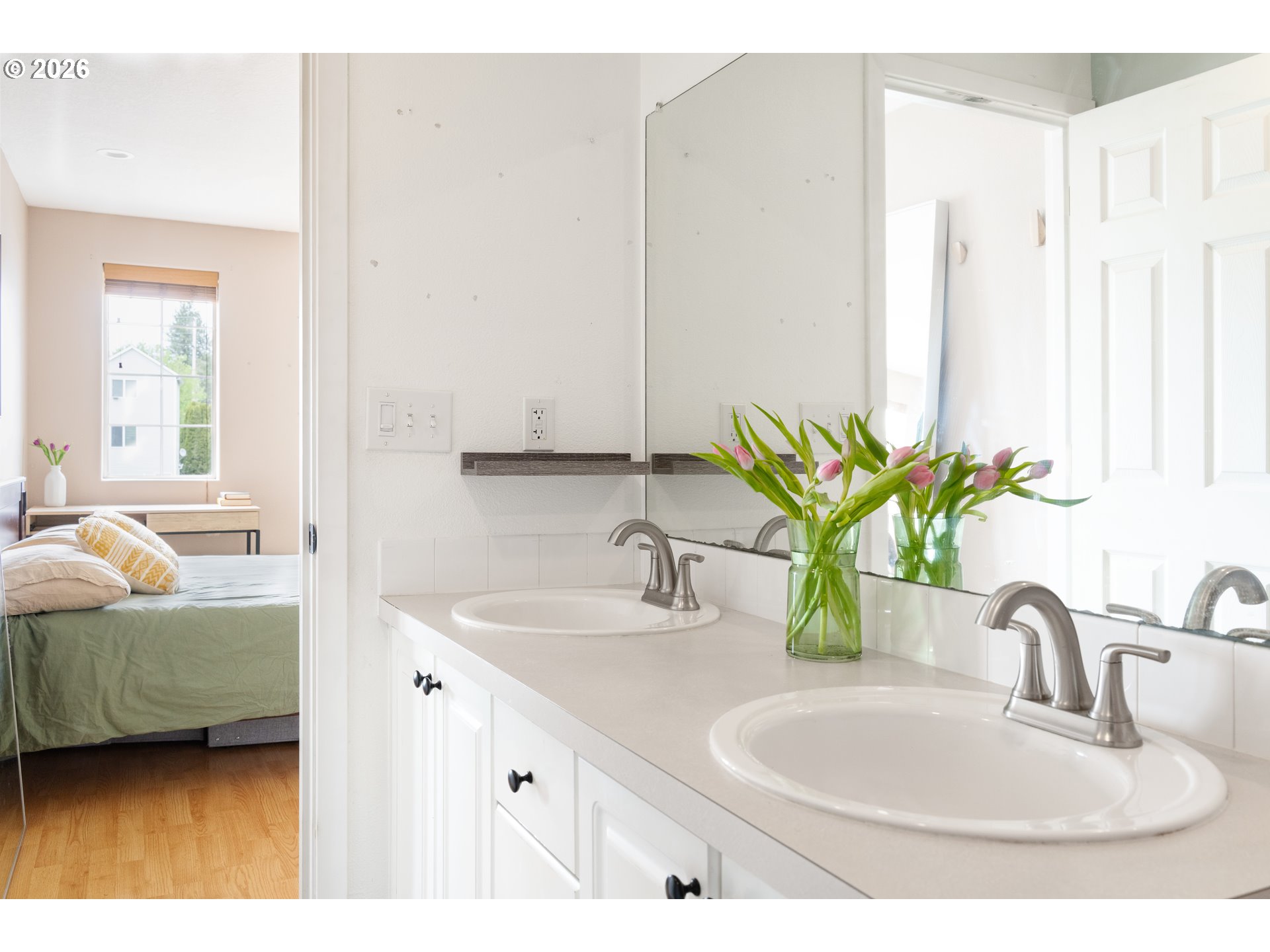 4083 Southwest 182nd Place Beaverton, OR 97078 - Photo 17 of 27 a bathroom with a double vanity sink and a mirror