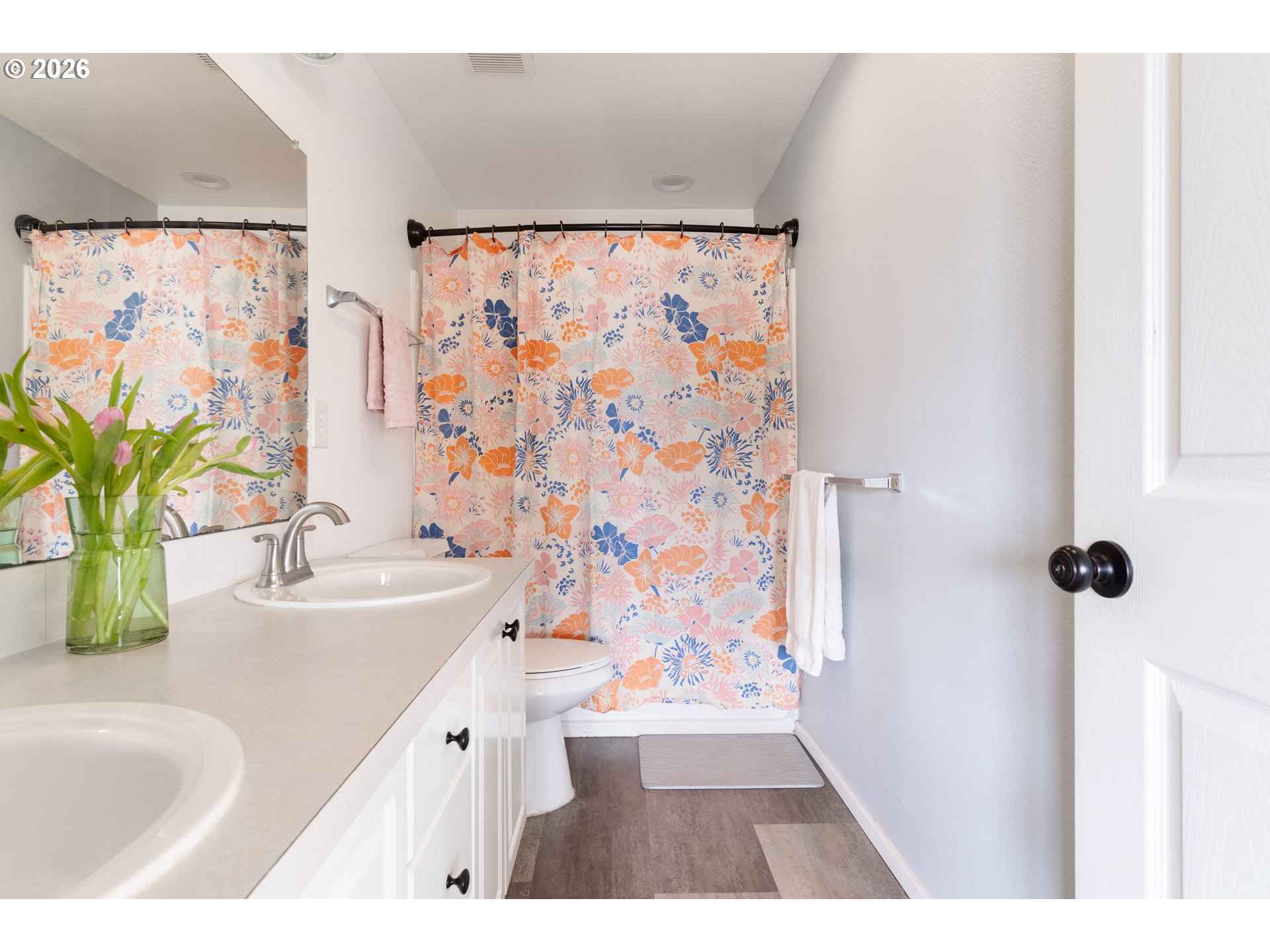 4083 Southwest 182nd Place Beaverton, OR 97078 - Photo 18 of 27 a bathroom with a sink a mirror and a bathtub