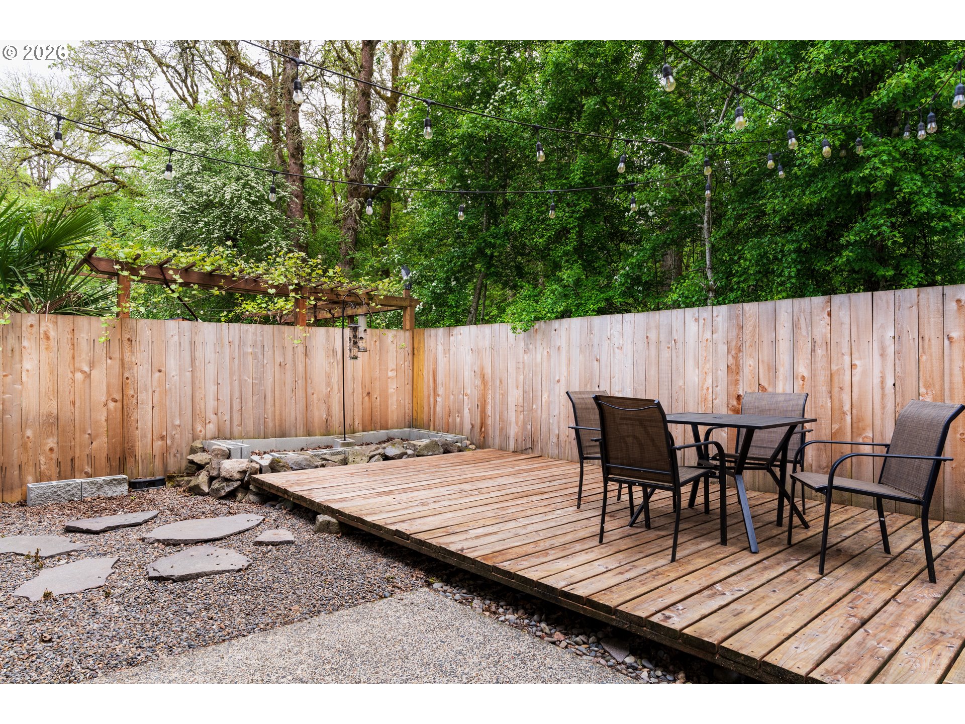 4083 Southwest 182nd Place Beaverton, OR 97078 - Photo 22 of 27 a view of wooden table and chairs in patio