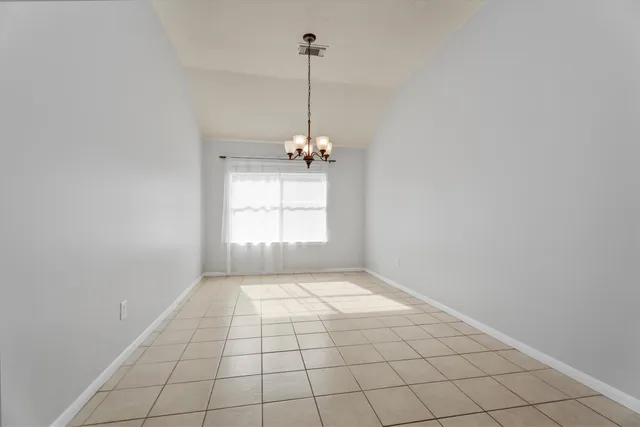 a view of an empty room and window shelves