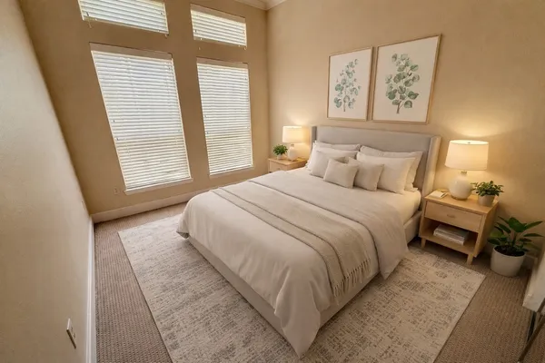 a bedroom with a bed and a window