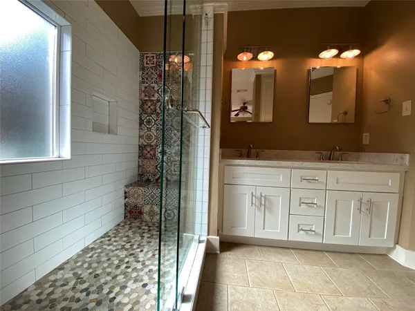 a bathroom with a sink a vanity and a mirror