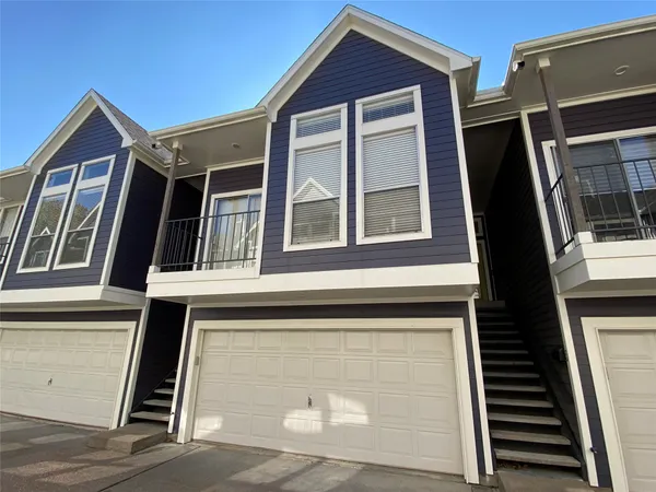 a view of a street with a building in the background