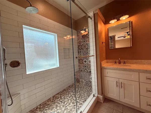 a bathroom with a sink and mirror