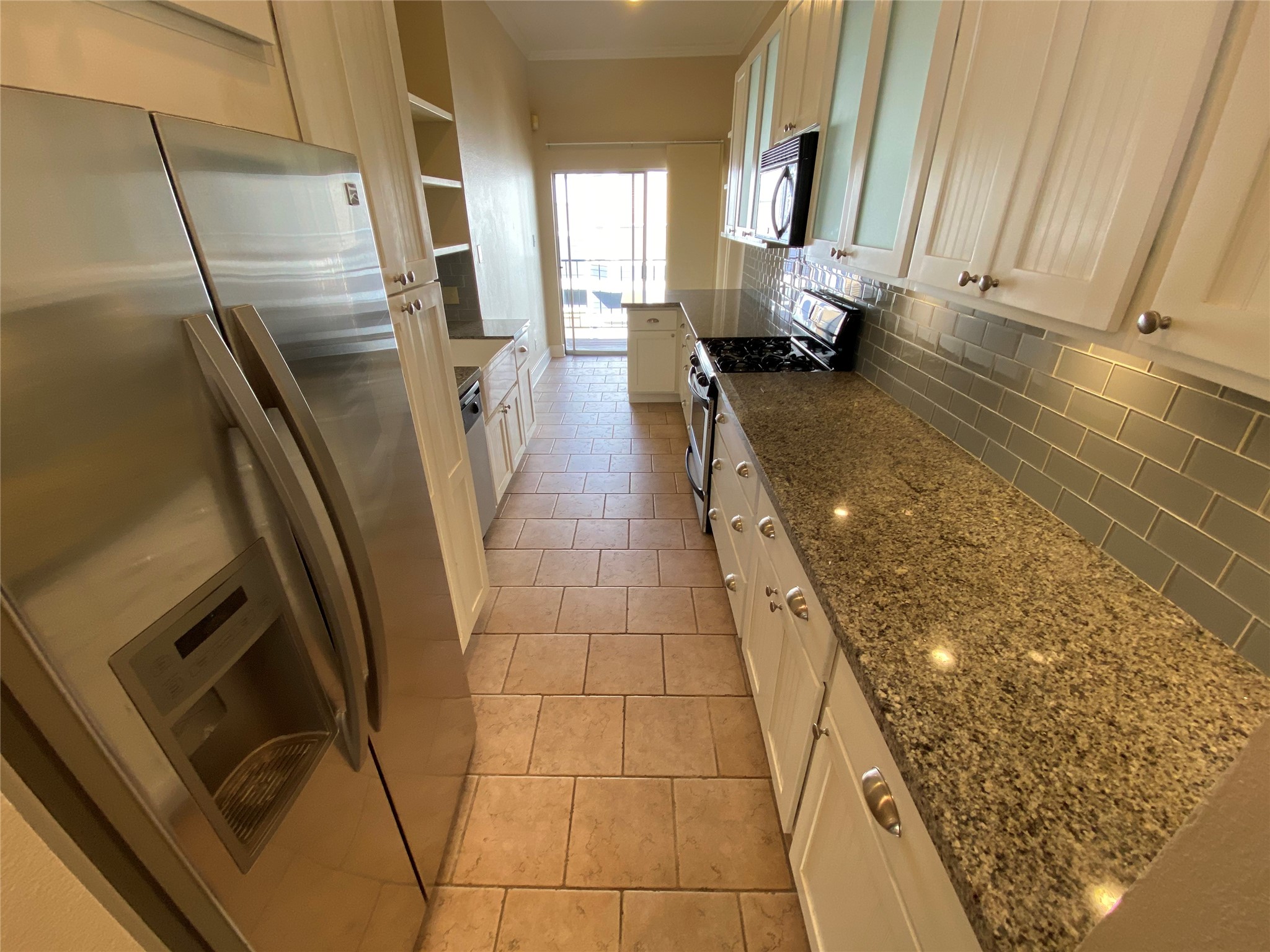 735 Arlington Street, Unit 3 Houston, TX 77007 - Photo 10 of 32 Chef-ready with stainless appliances, gas range, under-cabinet lighting and granite counters.