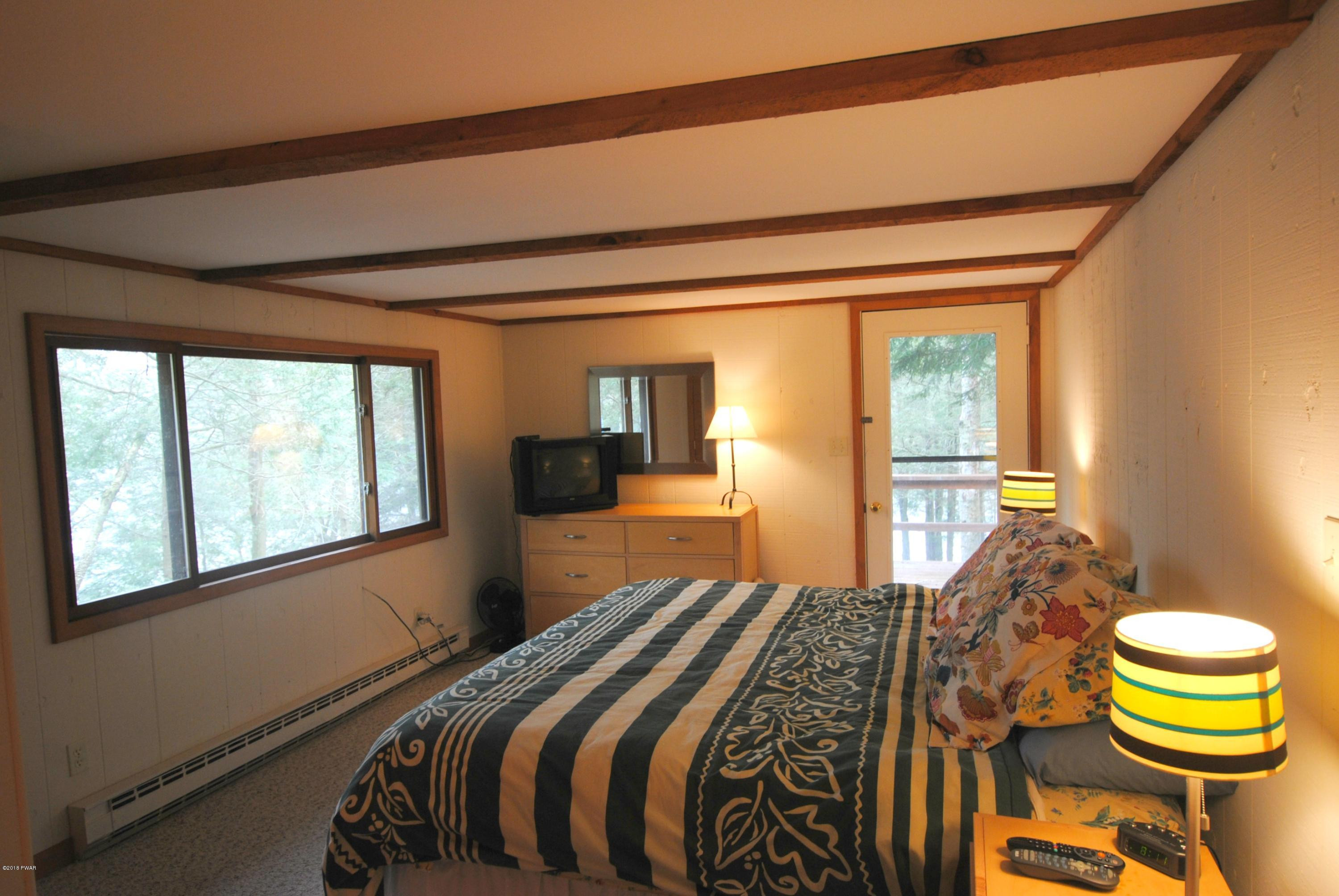 3036 Northgate Road Lake Ariel, PA 18436 - Photo 20 of 26 a bedroom with a bed and a large window