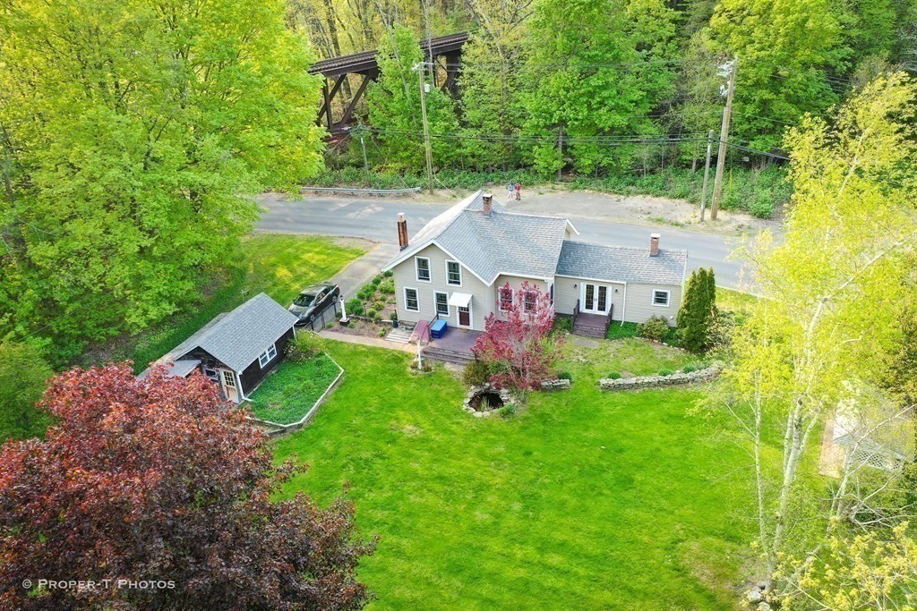 23 North Leverett Road Montague, MA 01351 - Photo 1 of 35 an aerial view of a house with swimming pool and garden