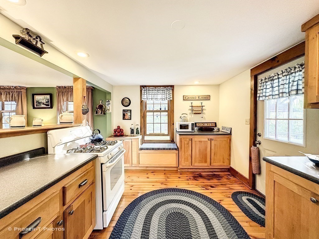 23 North Leverett Road Montague, MA 01351 - Photo 17 of 35 a view of a kitchen with stainless steel appliances granite countertop a stove and a sink