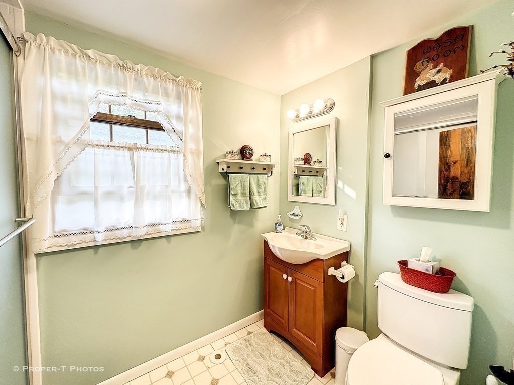 23 North Leverett Road Montague, MA 01351 - Photo 19 of 35 a bathroom with a sink mirror vanity and toilet
