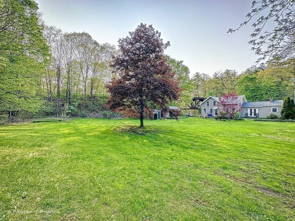 23 North Leverett Road Montague, MA 01351 - Photo 23 of 35 a view of a house with a backyard