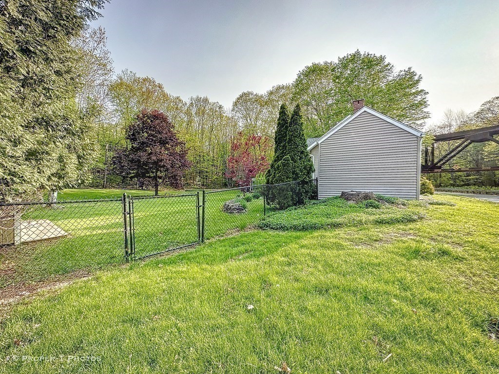 23 North Leverett Road Montague, MA 01351 - Photo 27 of 35 a view of a house with backyard and trees