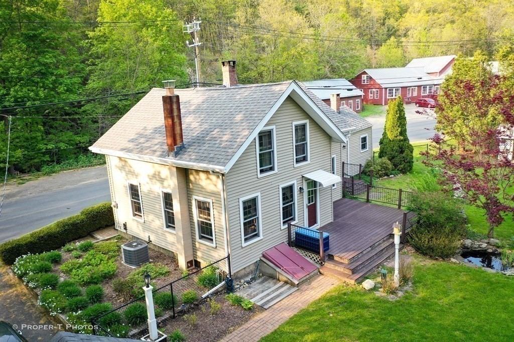 23 North Leverett Road Montague, MA 01351 - Photo 3 of 35 a aerial view of a house with table and chairs