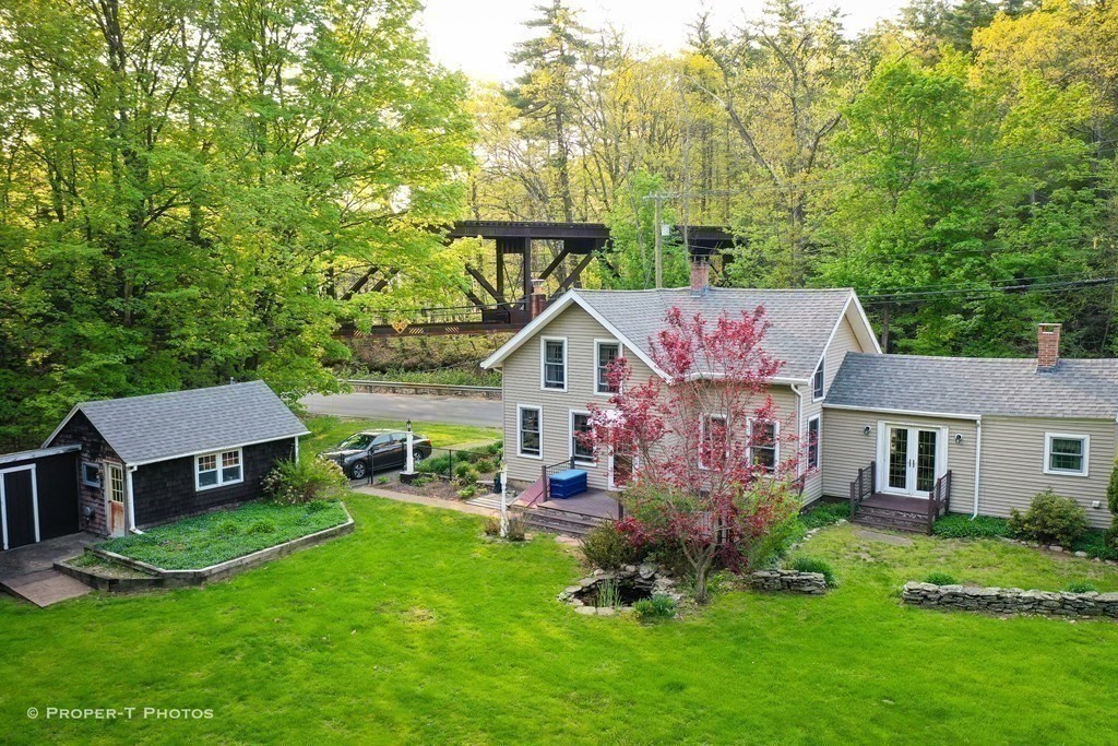 23 North Leverett Road Montague, MA 01351 - Photo 32 of 35 front view of a house with a yard