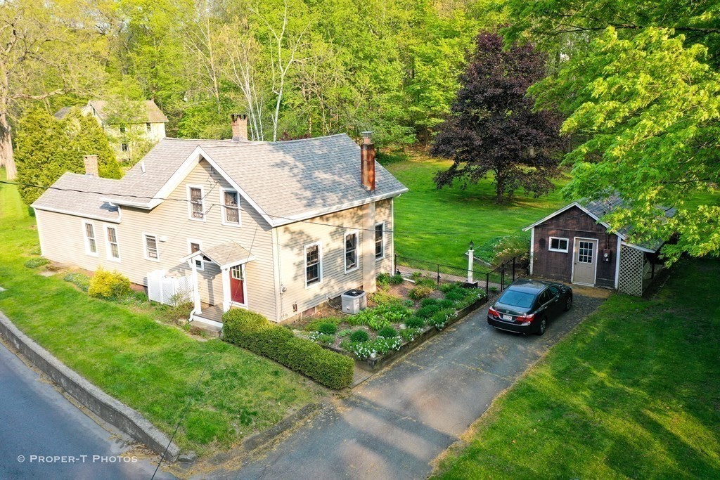 23 North Leverett Road Montague, MA 01351 - Photo 34 of 35 a view of a house with a yard and sitting area