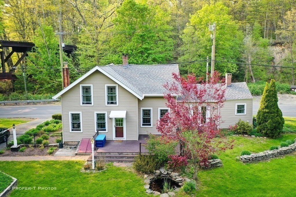 23 North Leverett Road Montague, MA 01351 - Photo 4 of 35 a front view of house with a garden and patio