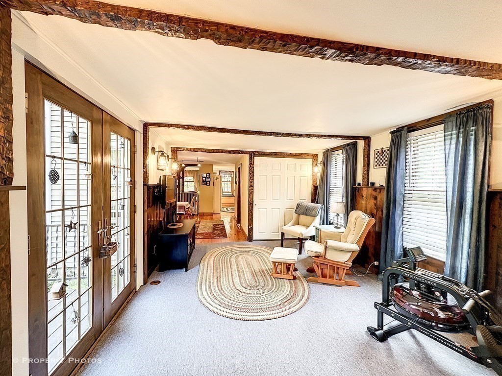 23 North Leverett Road Montague, MA 01351 - Photo 8 of 35 a room with furniture and large windows