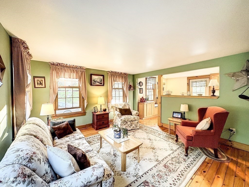 23 North Leverett Road Montague, MA 01351 - Photo 10 of 35 a living room with furniture and a large window