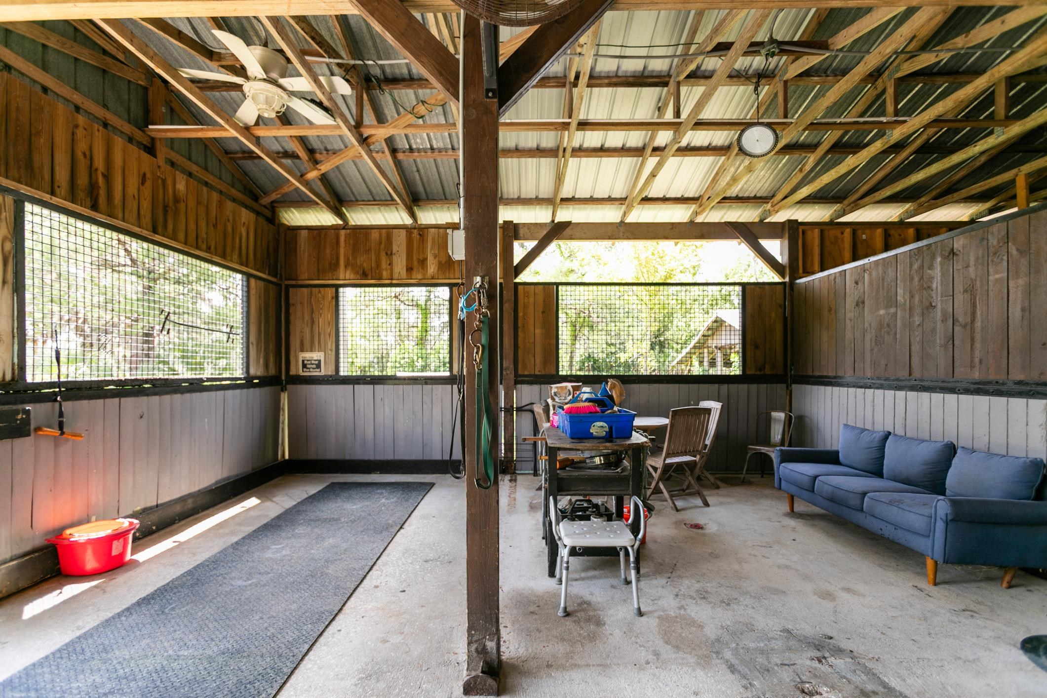 5210 County Road 305 Bunnell, FL 32110 - Photo 23 of 79 a living room with furniture a window and outdoor seating