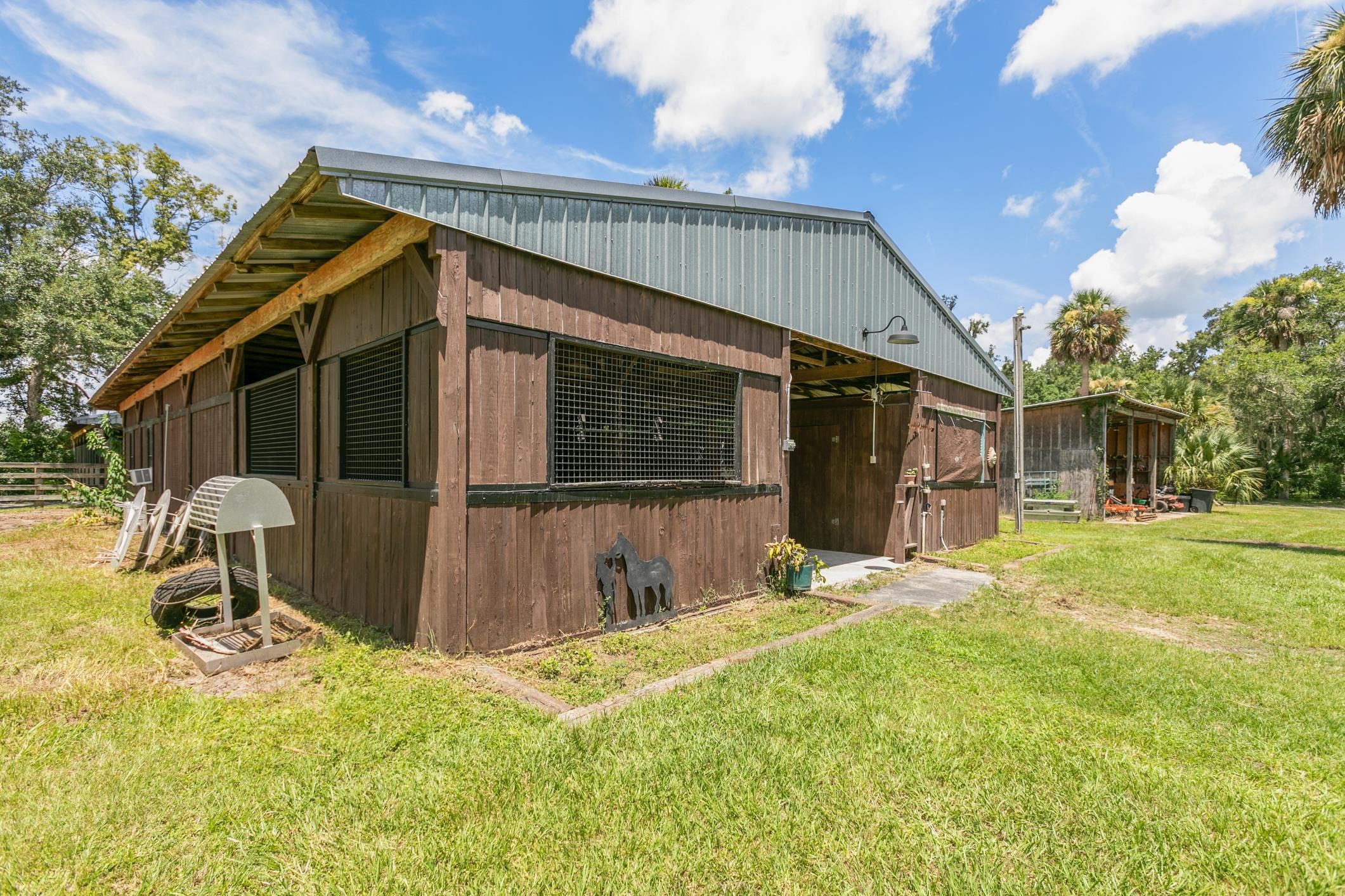5210 County Road 305 Bunnell, FL 32110 - Photo 25 of 79 a backyard of a house with yard and outdoor seating