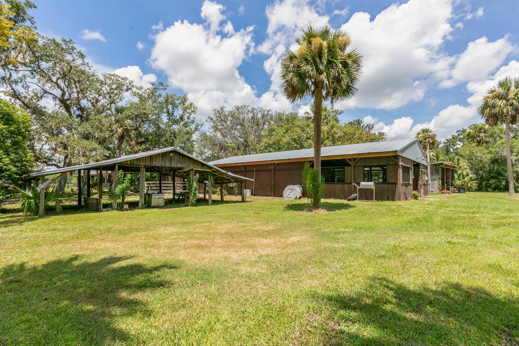 5210 County Road 305 Bunnell, FL 32110 - Photo 54 of 79 a front view of a house with a garden