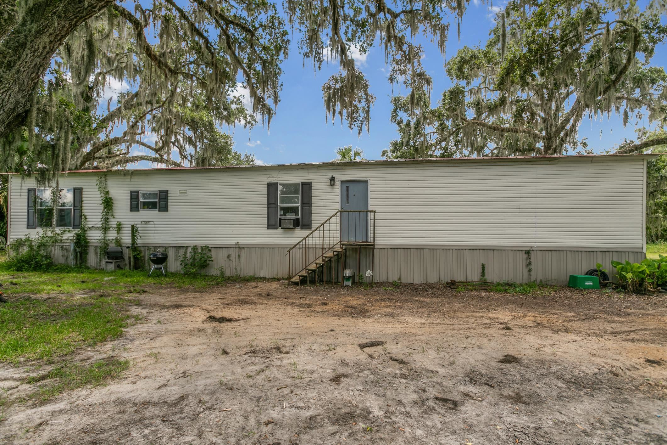 5210 County Road 305 Bunnell, FL 32110 - Photo 60 of 79 a view of a house with a backyard