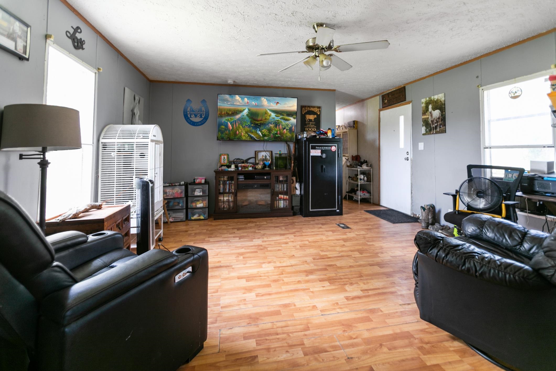 5210 County Road 305 Bunnell, FL 32110 - Photo 63 of 79 a living room with furniture and a flat screen tv