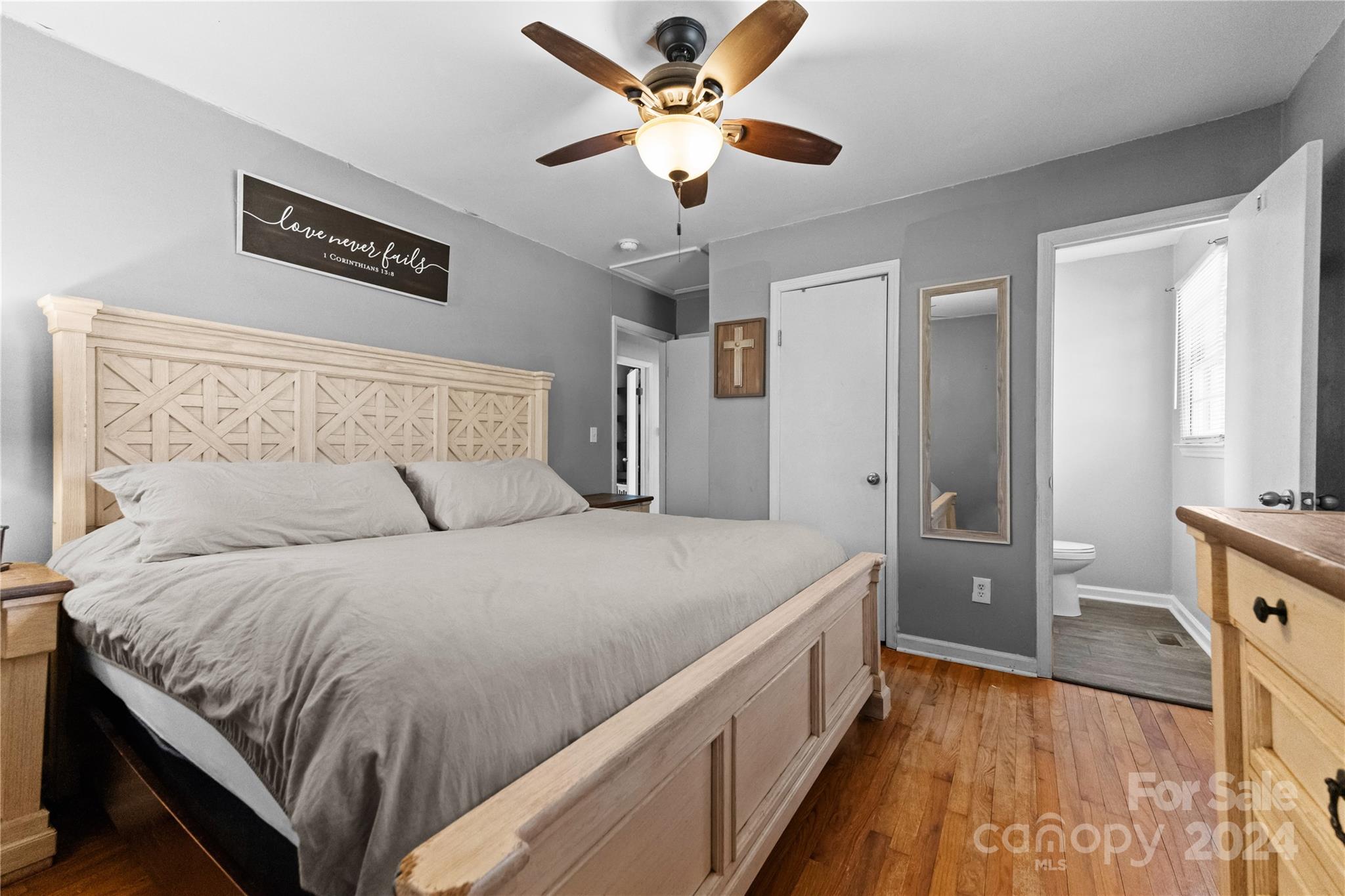 1267 Oak Hill Road Chester, SC 29706 - Photo 14 of 29 a spacious bedroom with a bed and a chandelier