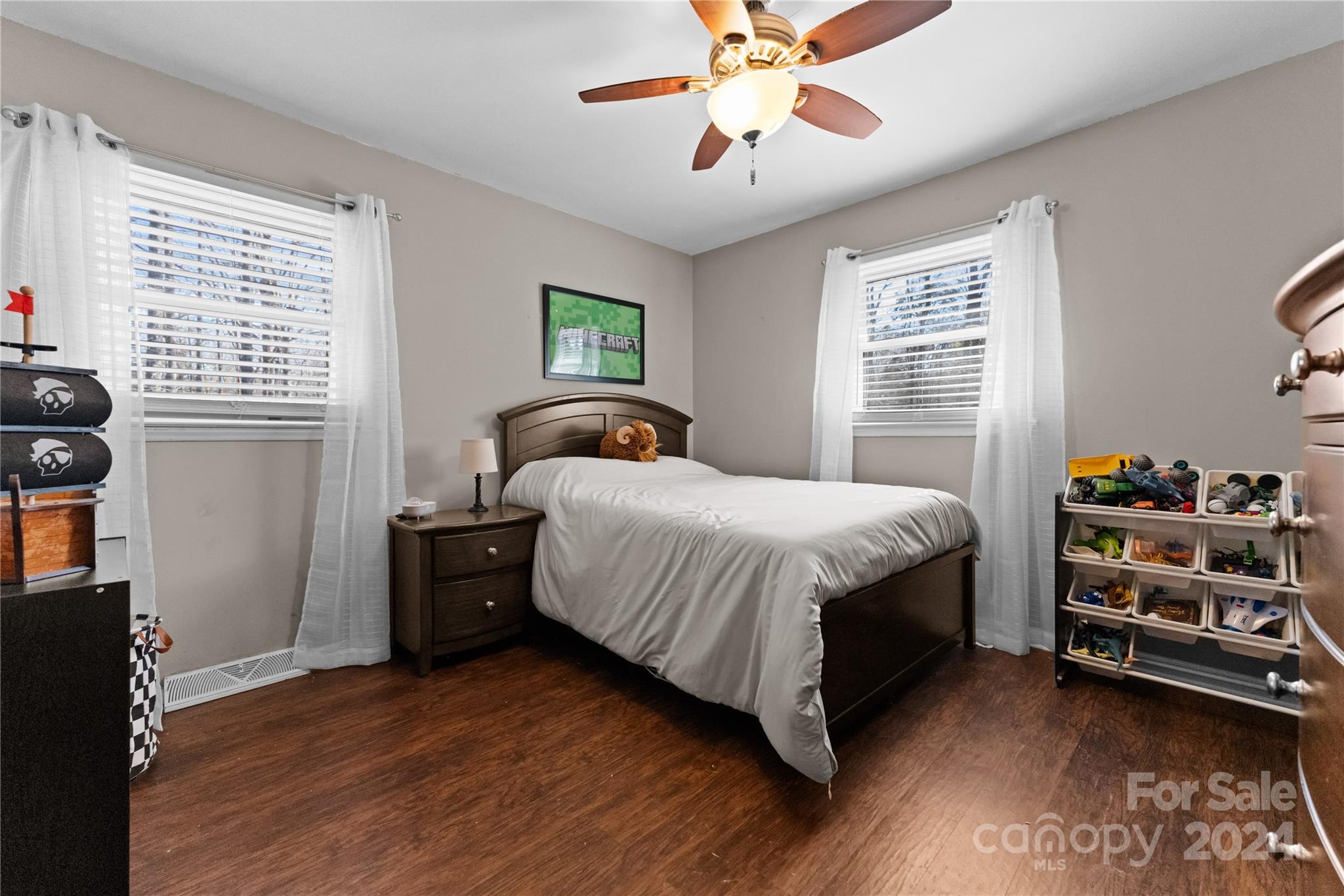 1267 Oak Hill Road Chester, SC 29706 - Photo 16 of 29 a bedroom with a bed and a chandelier