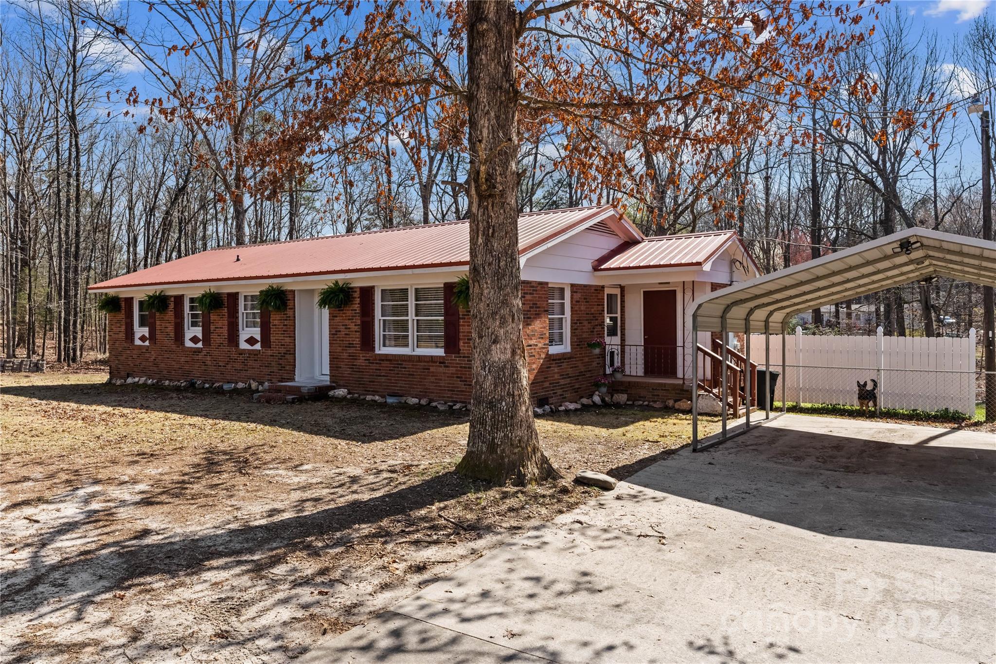 1267 Oak Hill Road Chester, SC 29706 - Photo 2 of 29 a front view of a house with a yard covered with snow