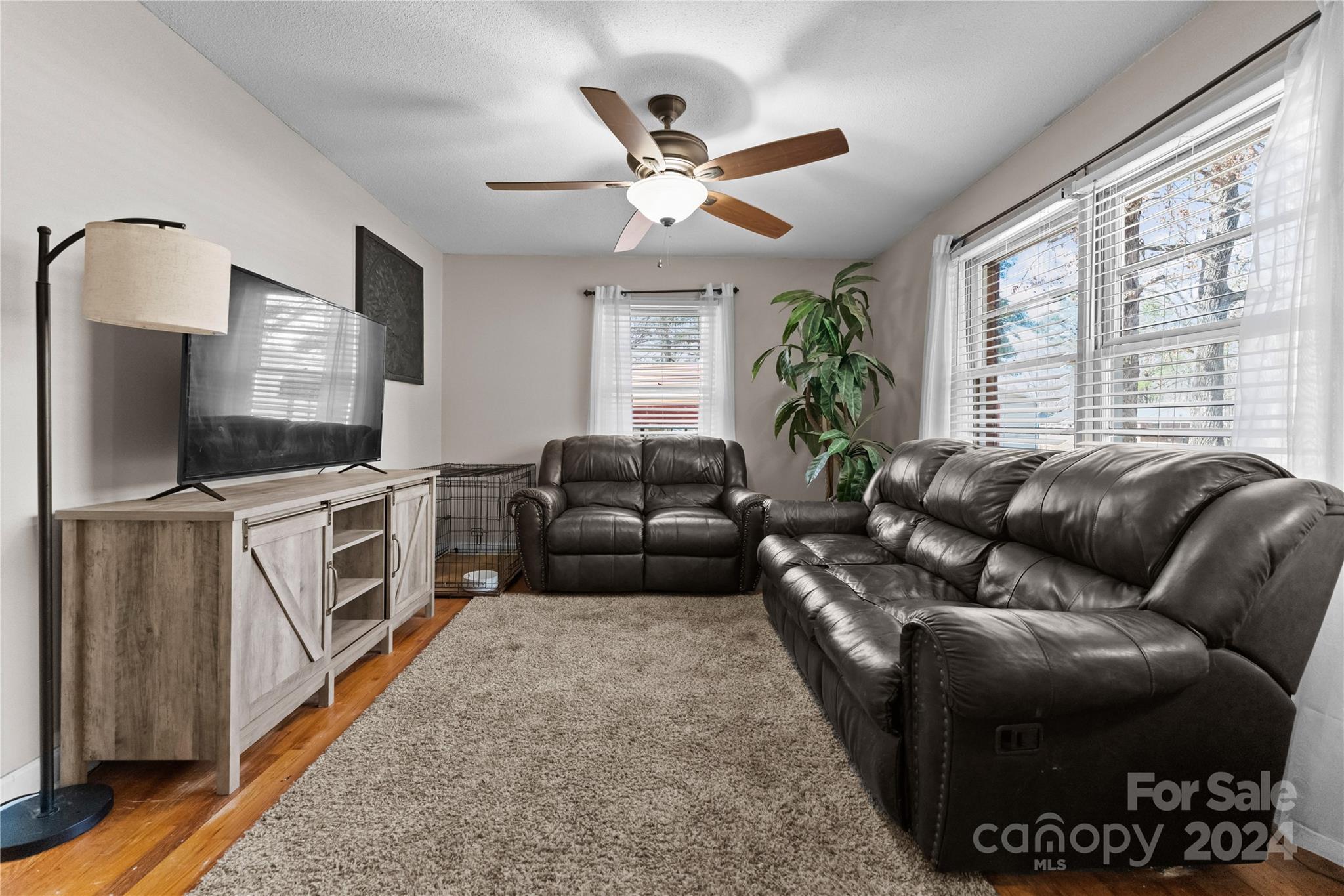 1267 Oak Hill Road Chester, SC 29706 - Photo 3 of 29 a living room with furniture a flat screen tv and a large window