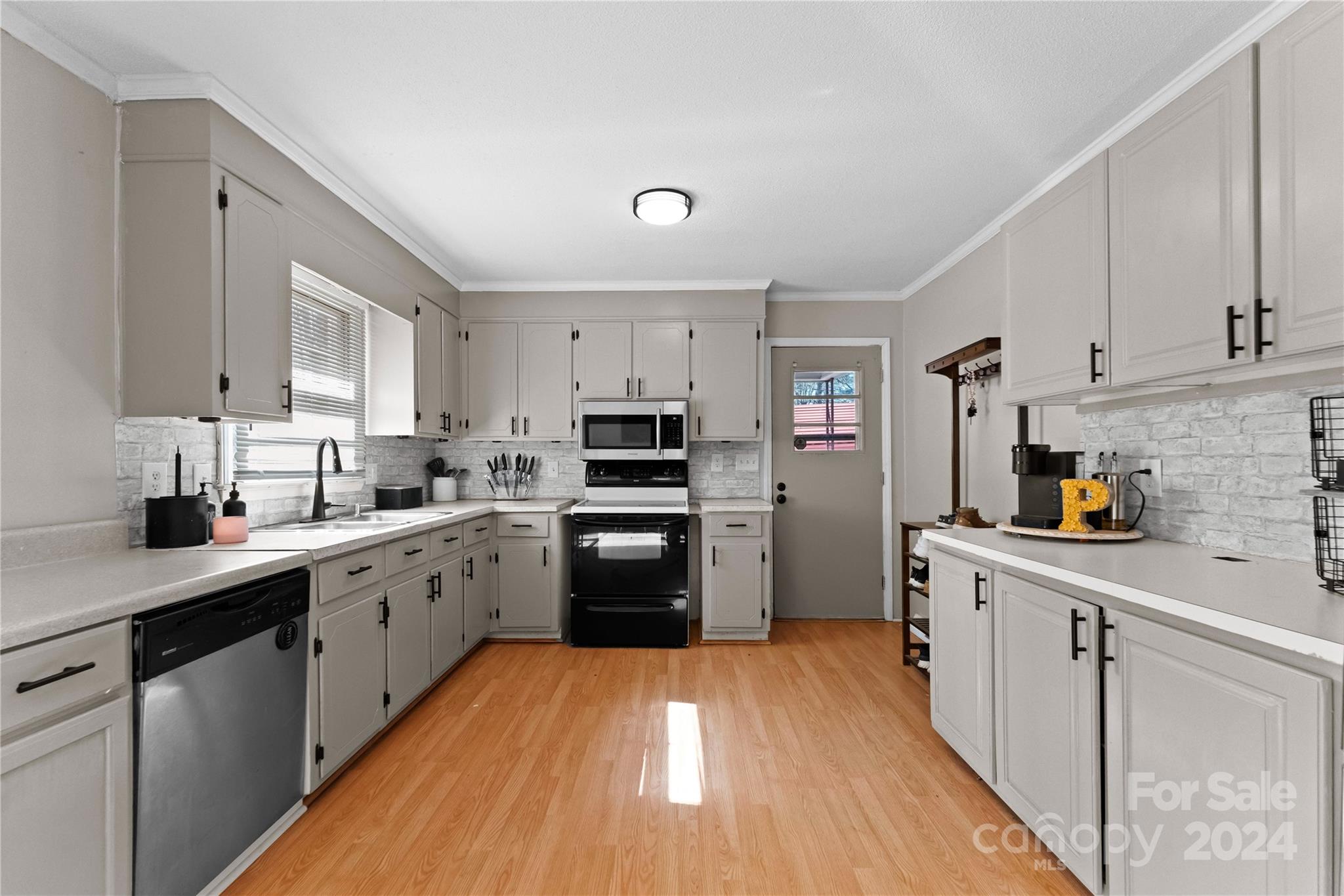 1267 Oak Hill Road Chester, SC 29706 - Photo 6 of 29 a kitchen with cabinets stainless steel appliances and a window