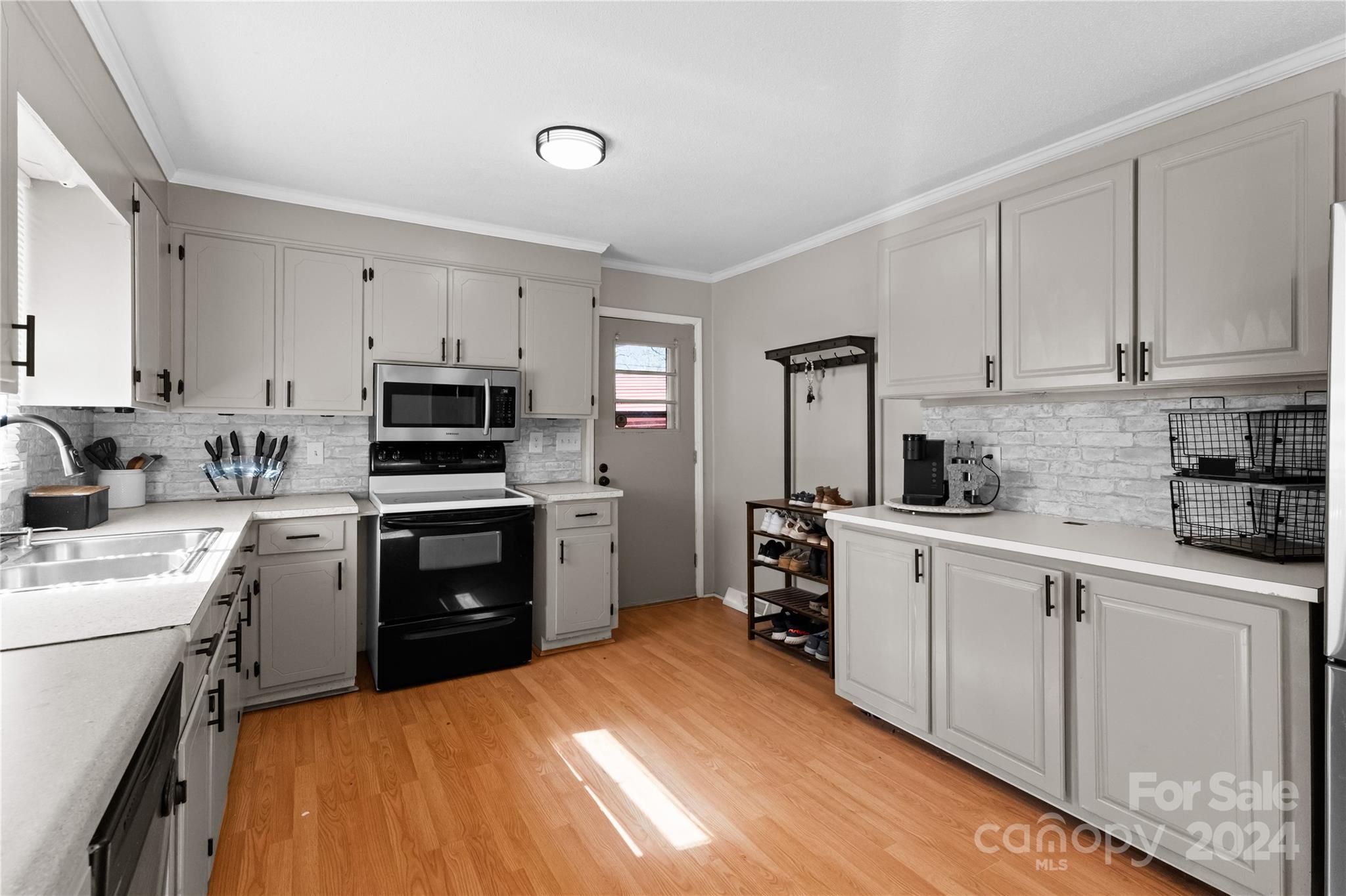 1267 Oak Hill Road Chester, SC 29706 - Photo 7 of 29 a kitchen with white cabinets and appliances
