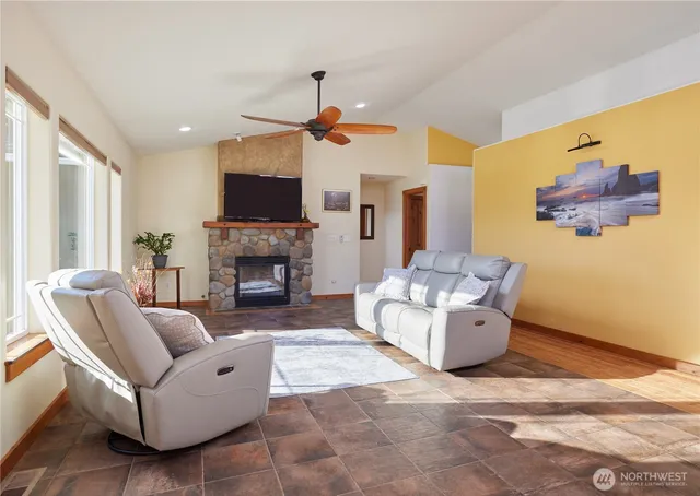 a living room with furniture and a fireplace