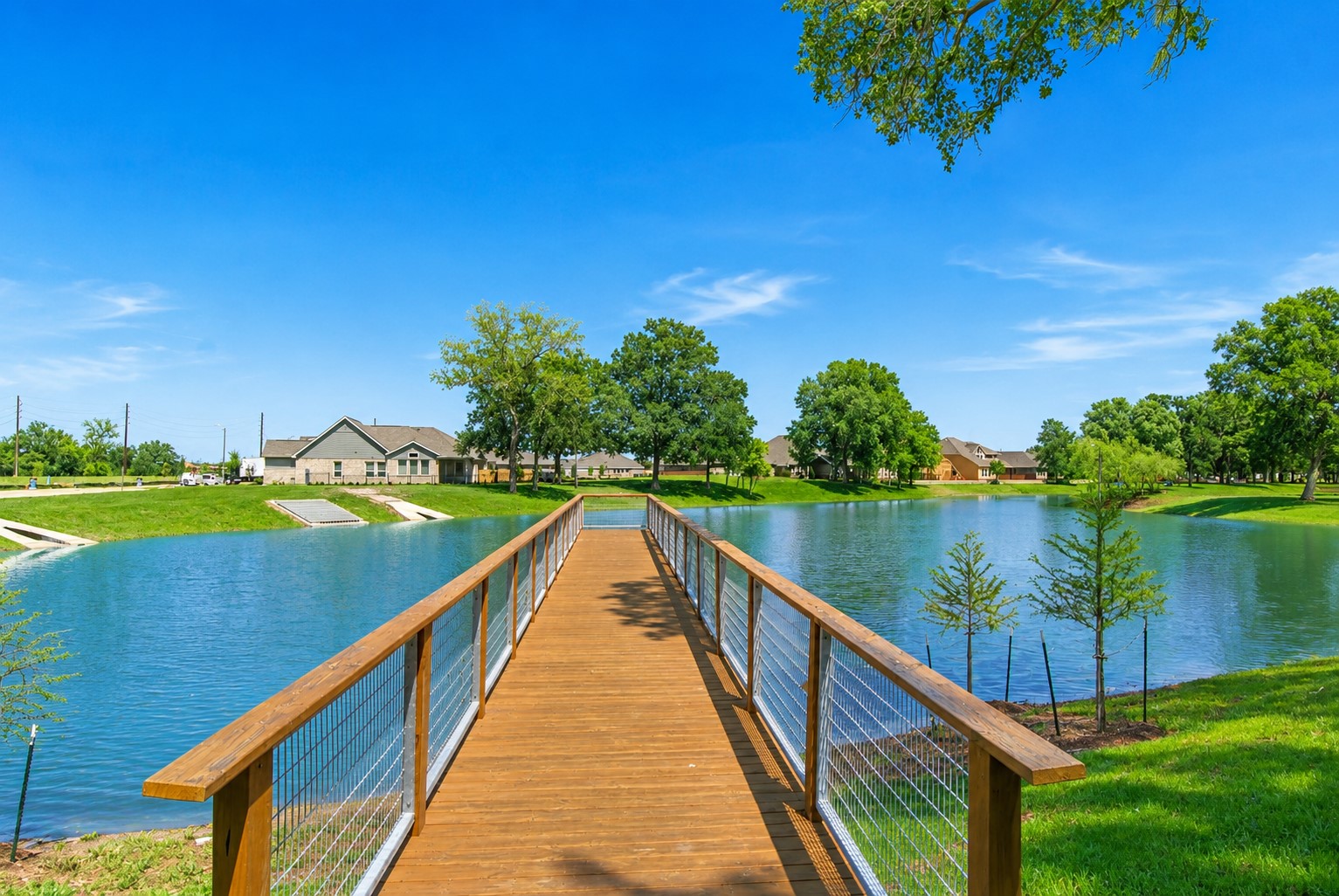 32607 Fly Fish Way Fulshear, TX 77441 - Photo 37 of 41 Serving as both a picturesque focal point and a unique neighborhood amenity, it offers a daily reminder of the tranquil lakefront lifestyle that makes this home so special.